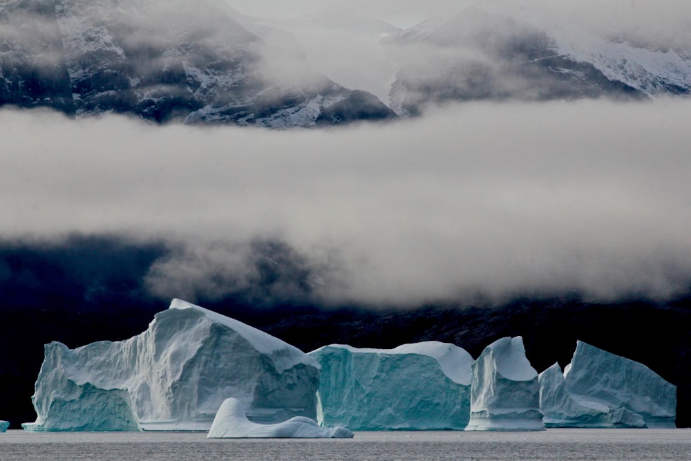 ice burn under grace cloud surrounded by body of water