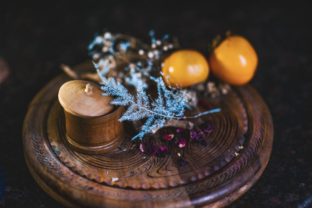 a close up of some fruit on a wooden plate