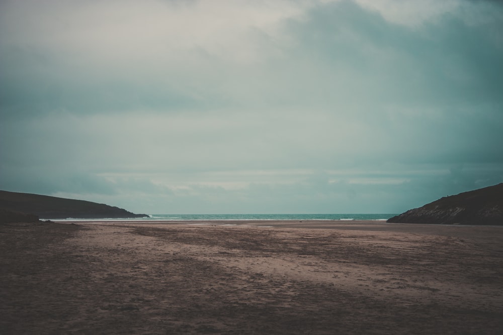 blue ocean water and beach shore during daytime