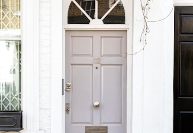 white wooden door mounted white wall