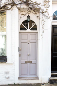 white wooden door mounted white wall