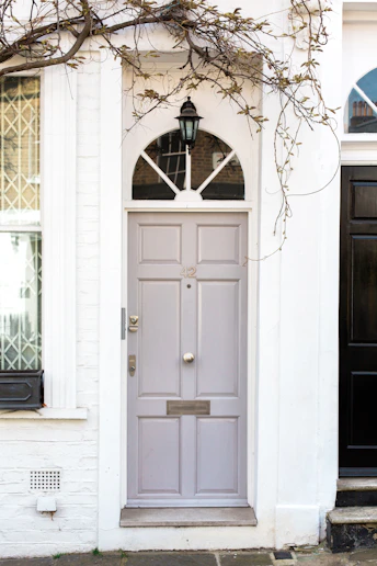 white wooden door mounted white wall