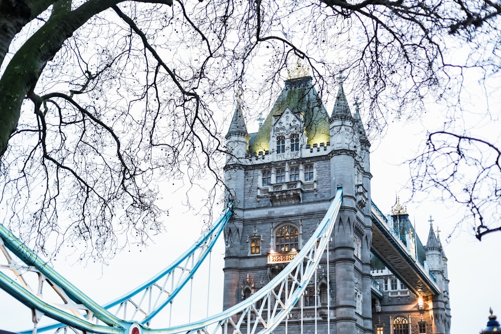 the tower of a building with a bridge in front of it