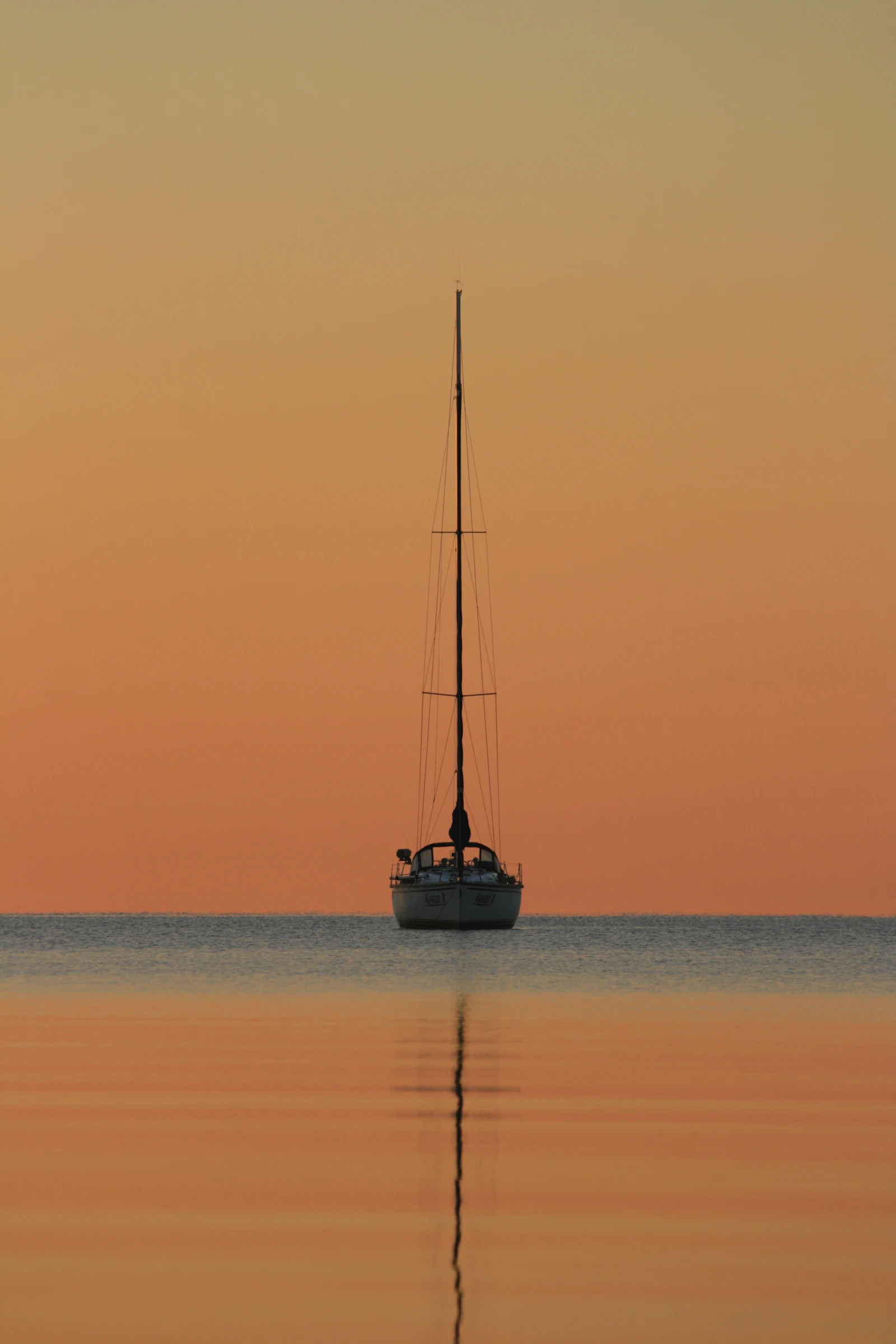 Sailing at golden hour on calm water