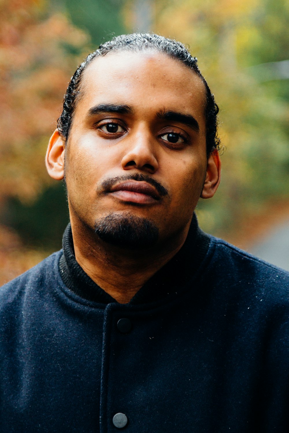 man wearing blue button-up jacket