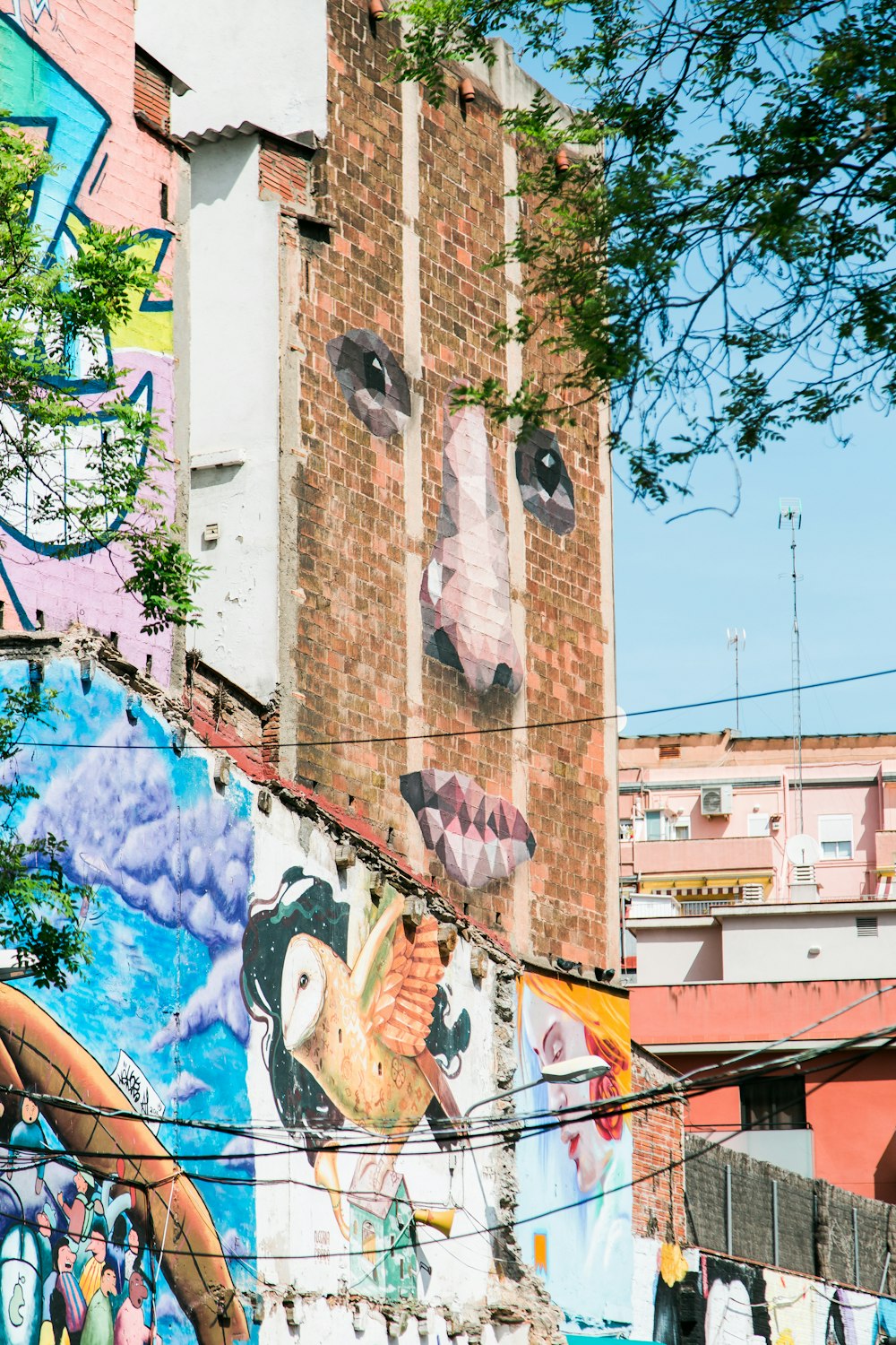 a mural of a cow on the side of a building