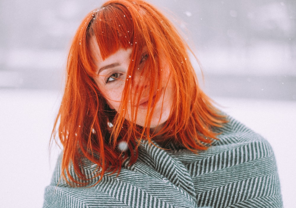 selective focus photography of woman during snow