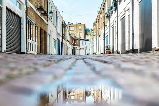 low angle view photography of brown pathway between hoses in Kensington United Kingdom