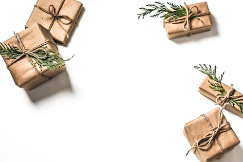 Stack of wrapped presents with kraft paper and ribbon
