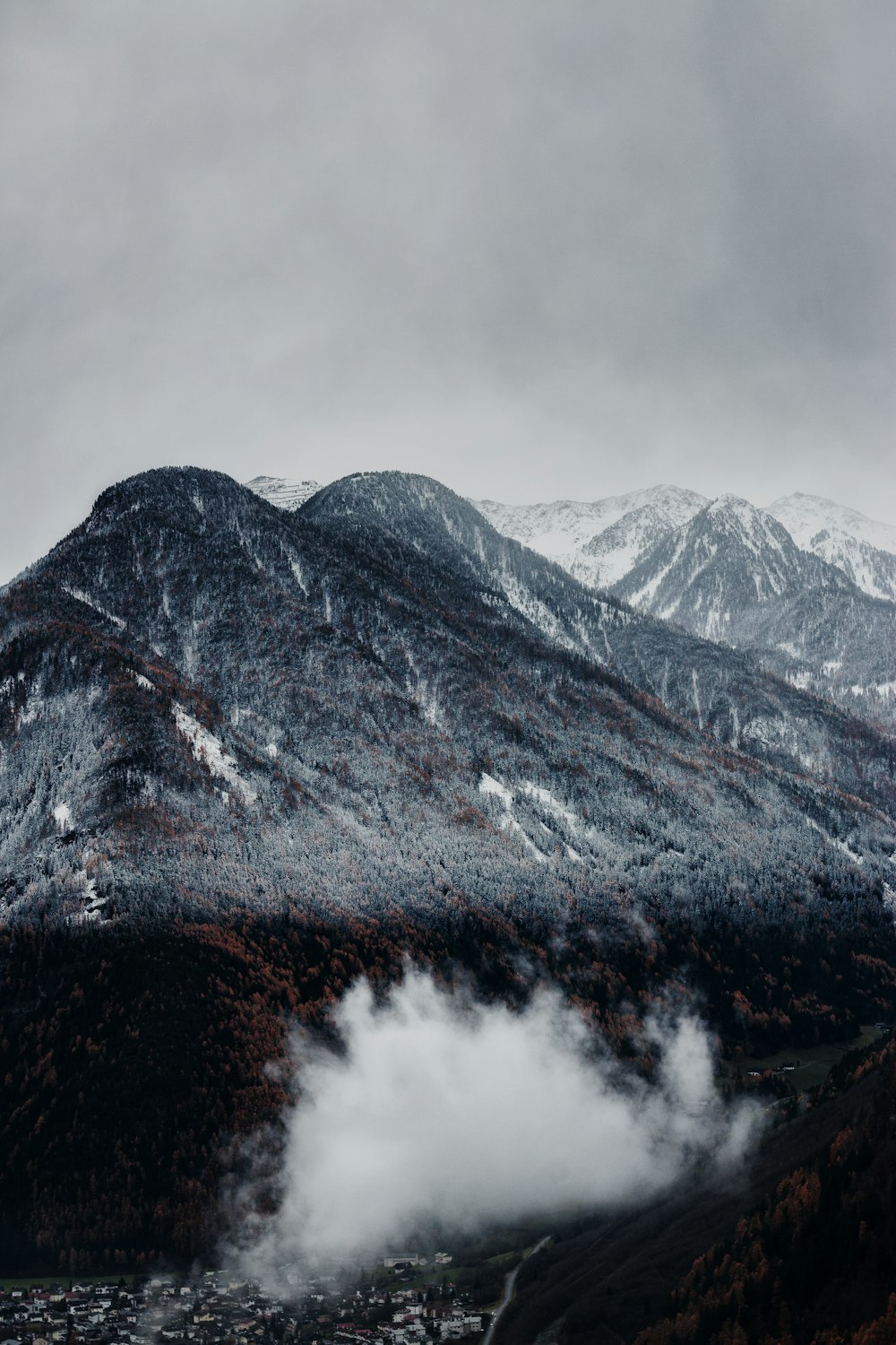 town near snow capped mountain