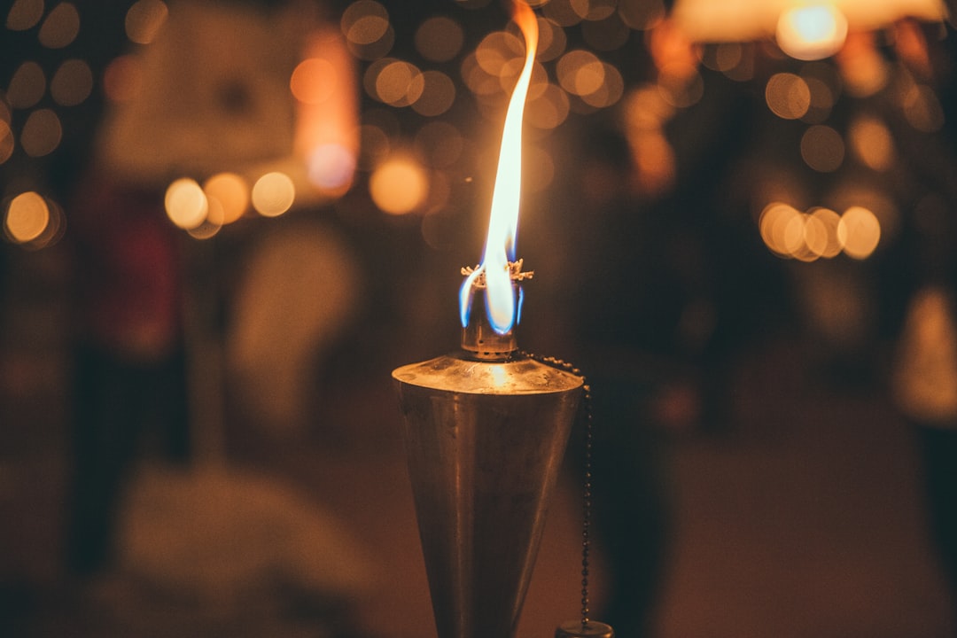 selective focus photography of torch