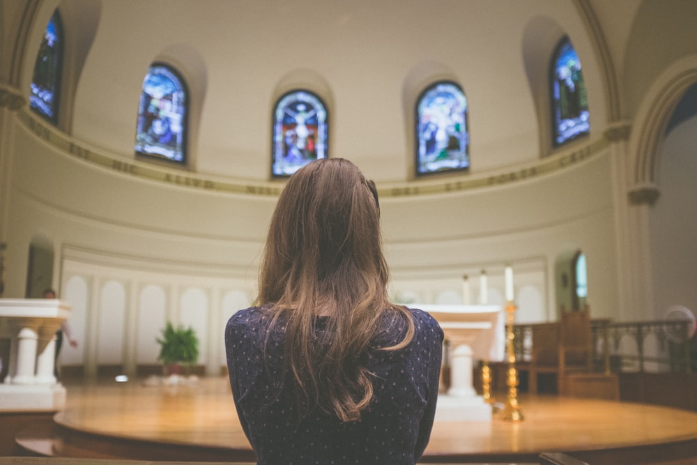 woman looking at stage indoor