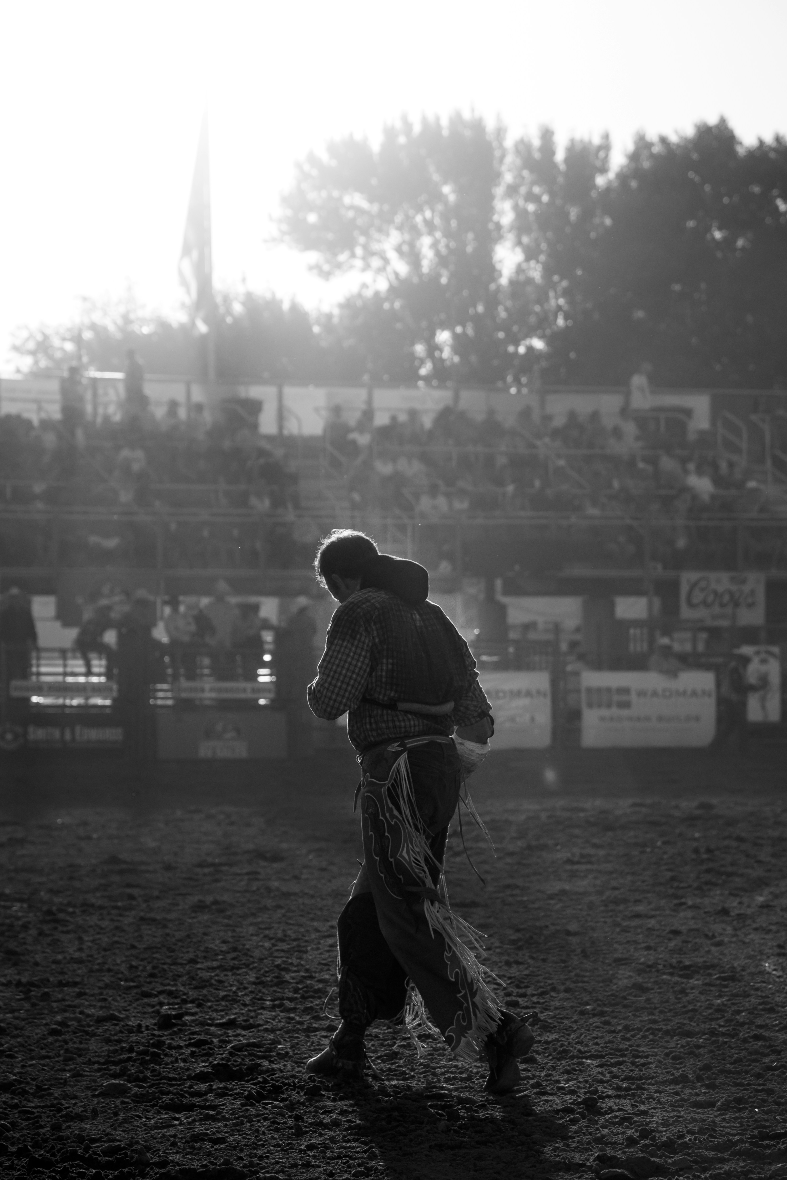 grayscale photo of man wearing cowboy chaps