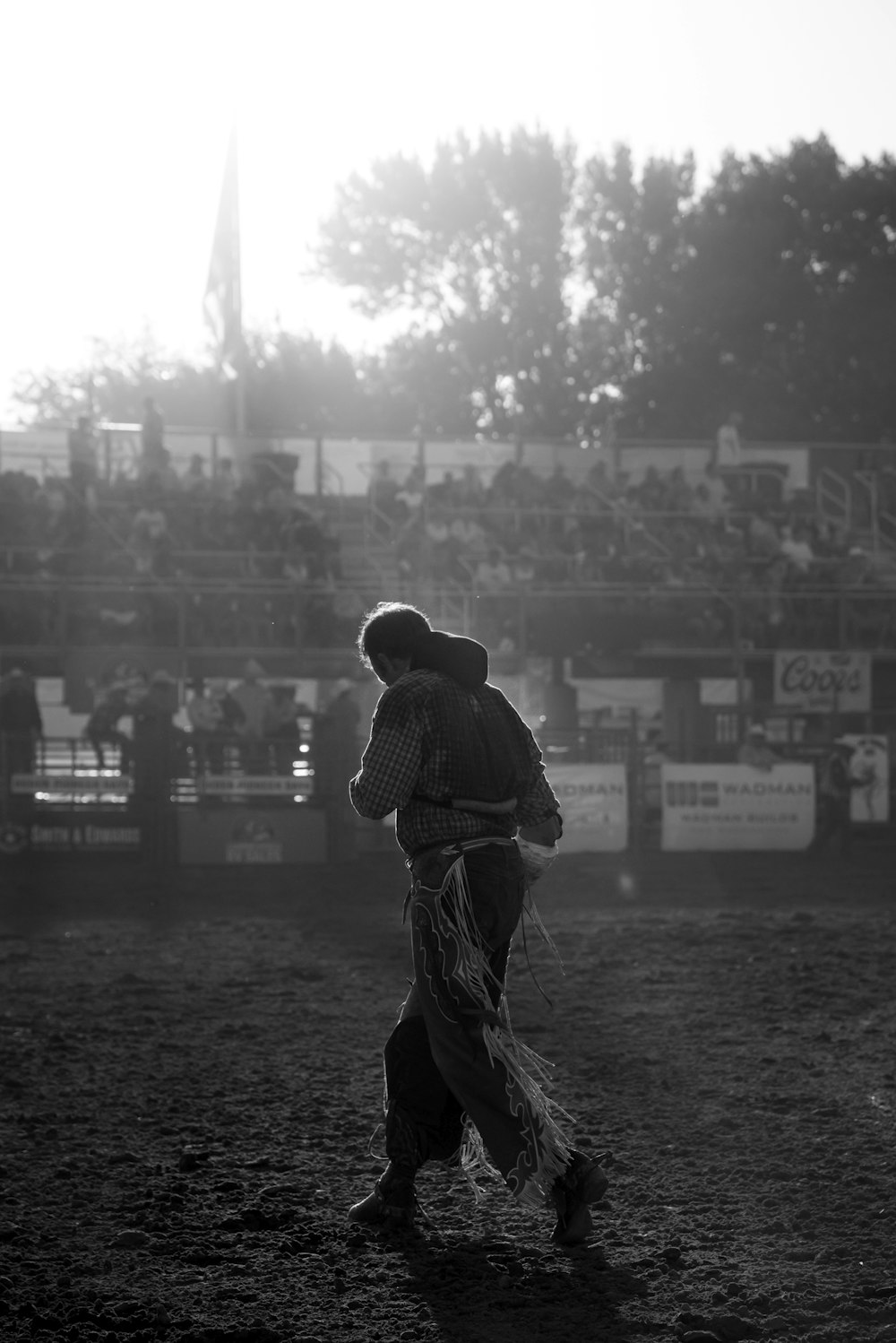 grayscale photo of man wearing cowboy chaps