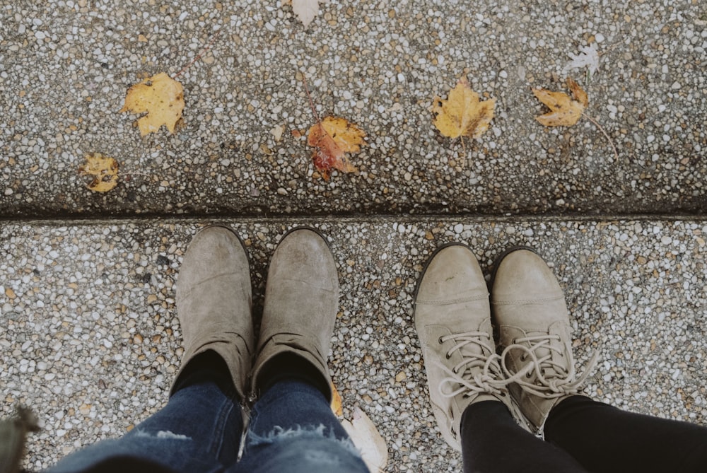 two pairs of brown leather Chukka boots and booties