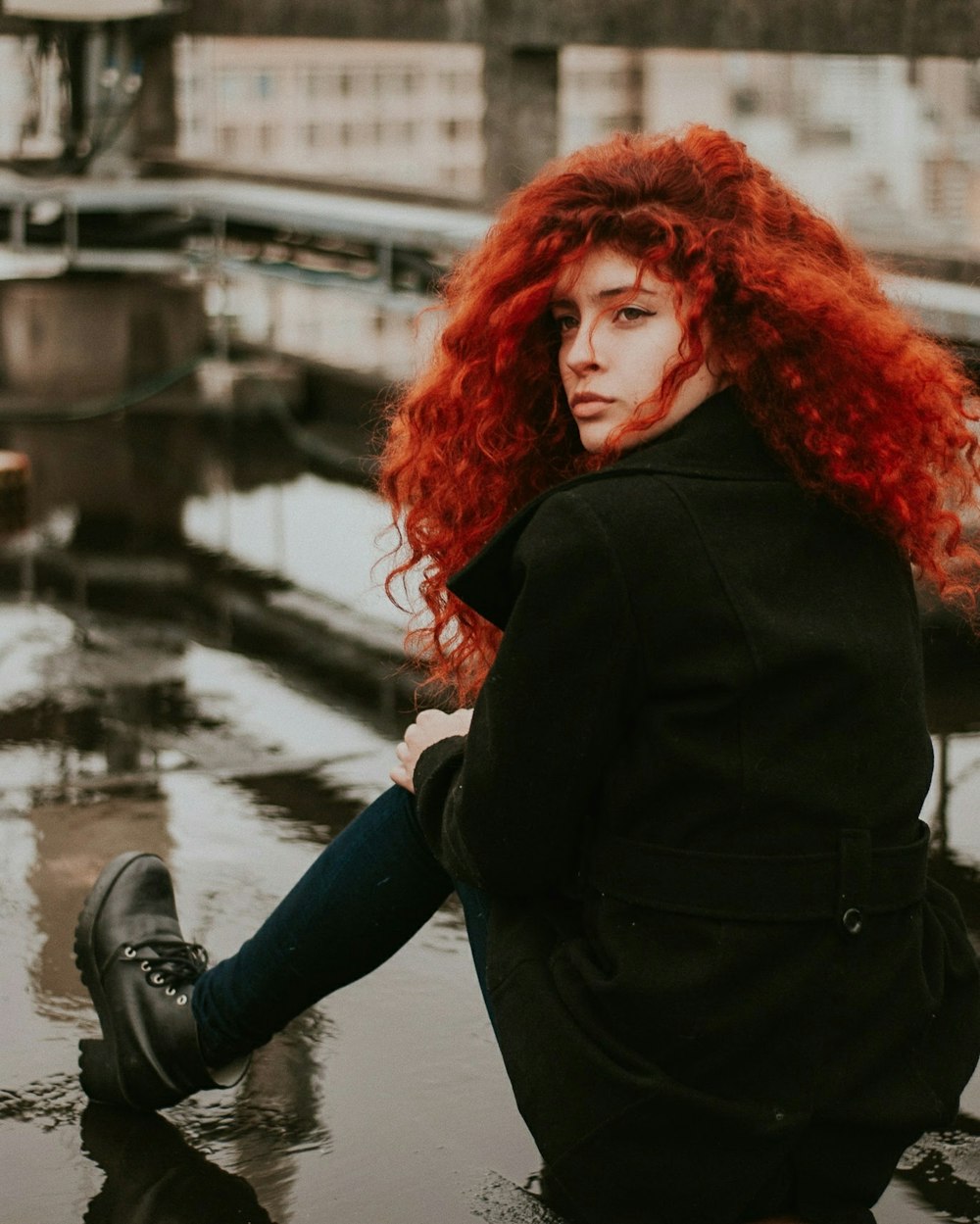 woman sitting on brown surface