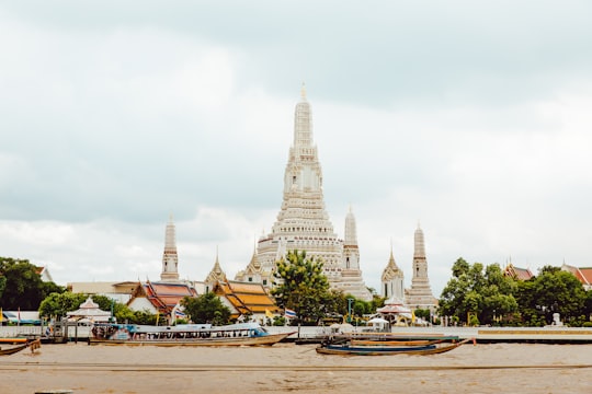 white and gray concrete building under gray sky in Eat Sight Story Thailand