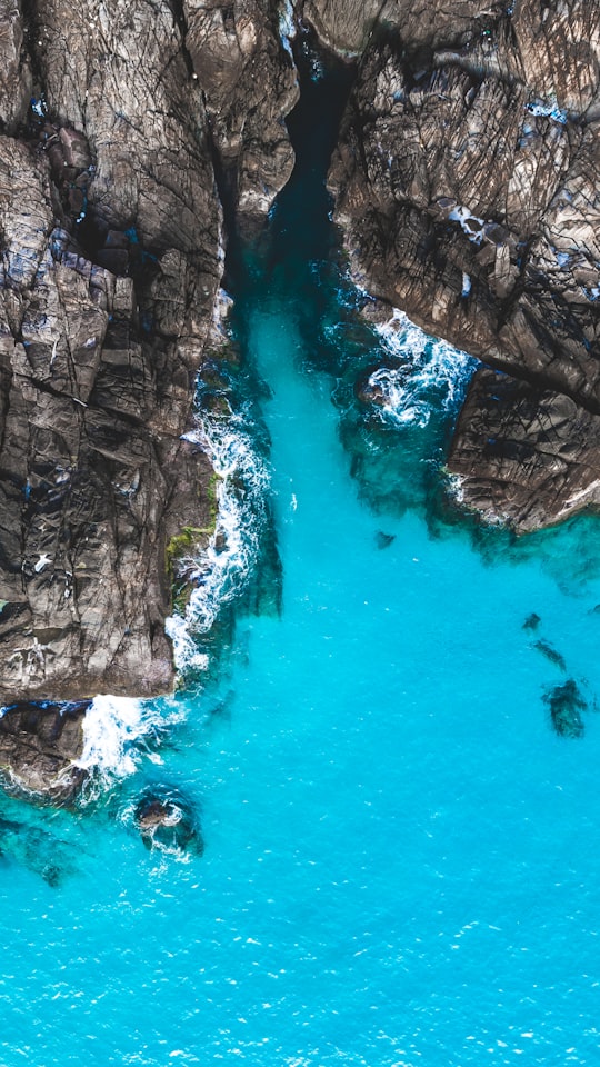 aerial photography of body of water beside cliff during day in Perhentian Islands Malaysia