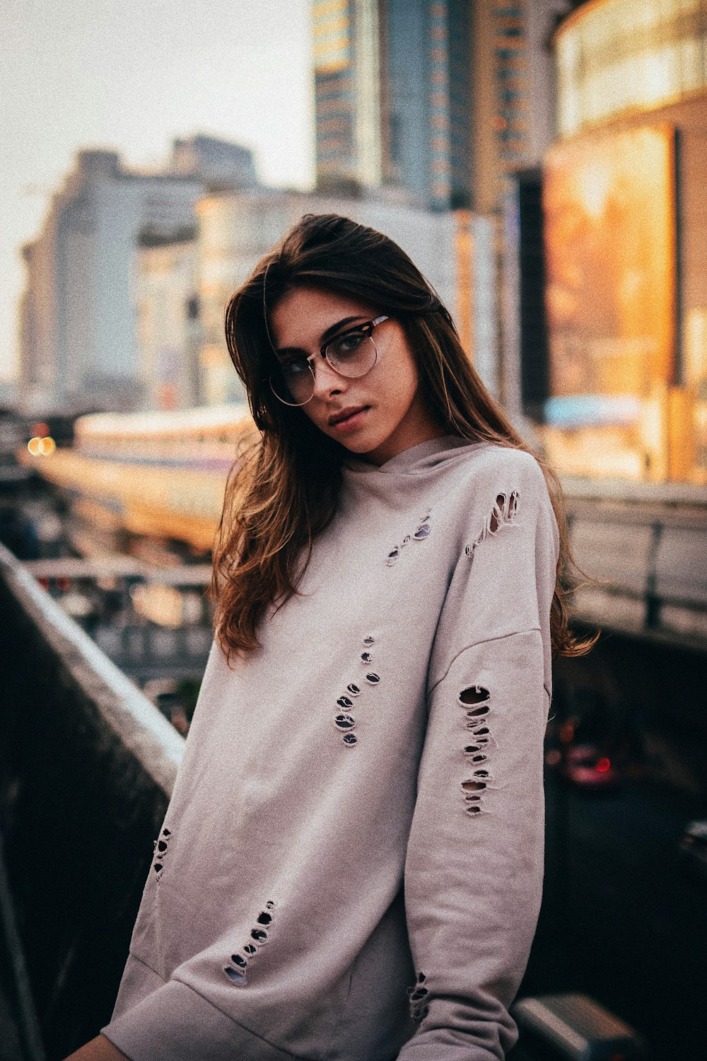 woman standing on bridge