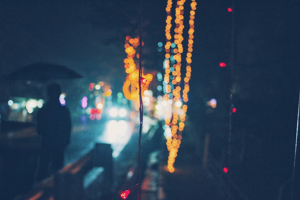 a blurry photo of a person holding an umbrella