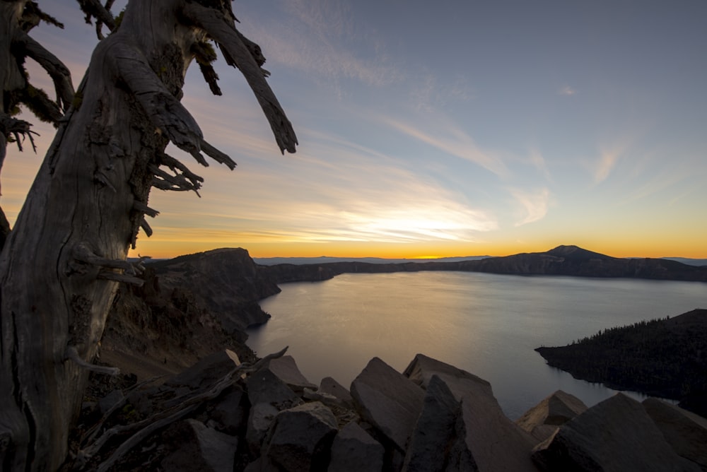 body of water during sunset