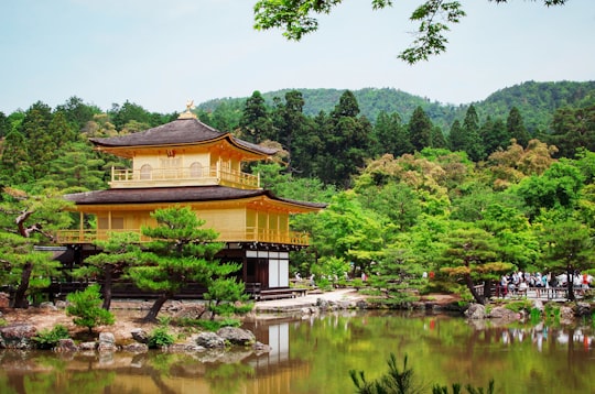 beige house near beside body of water in Kinkaku-ji Japan