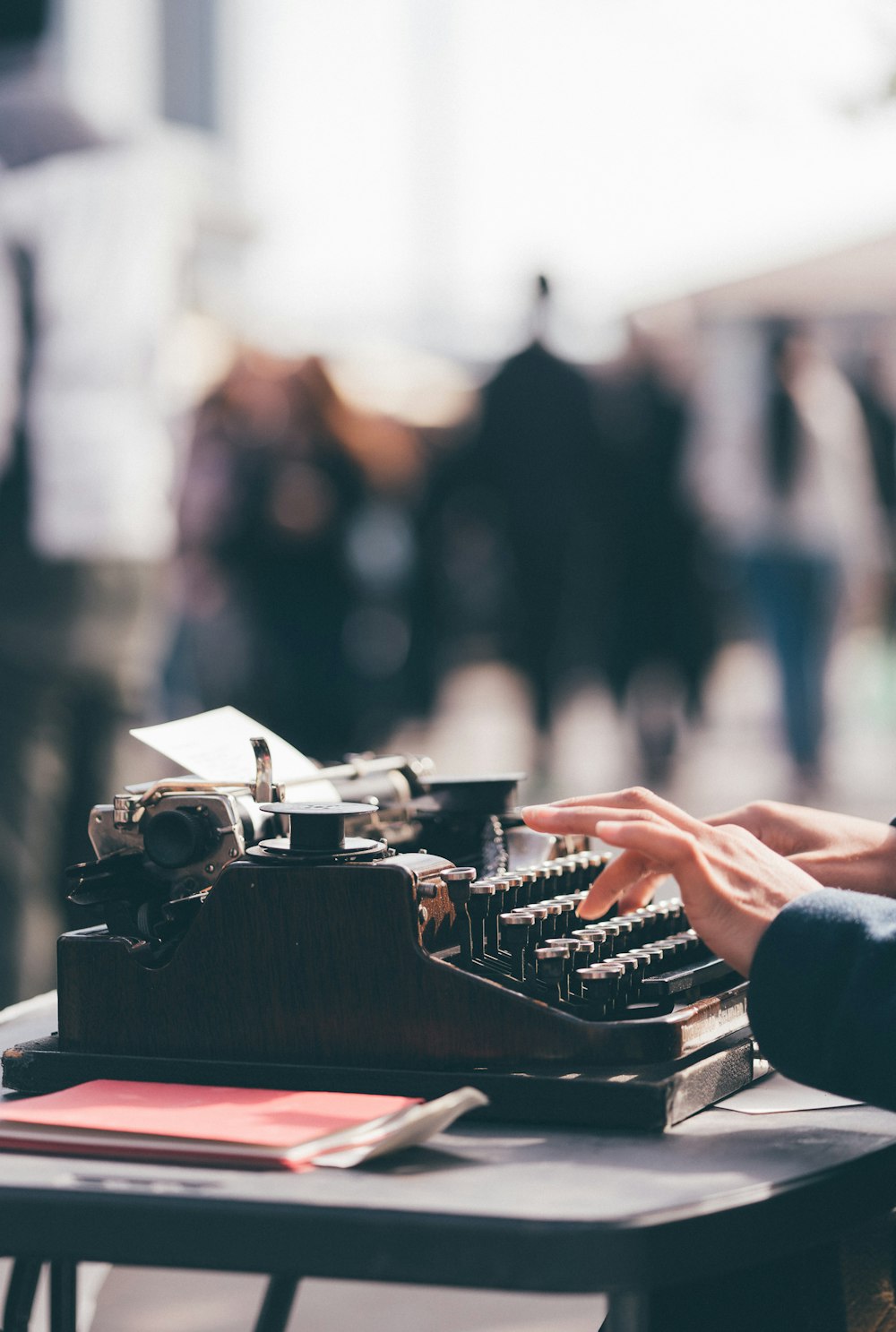 person using black typewriter