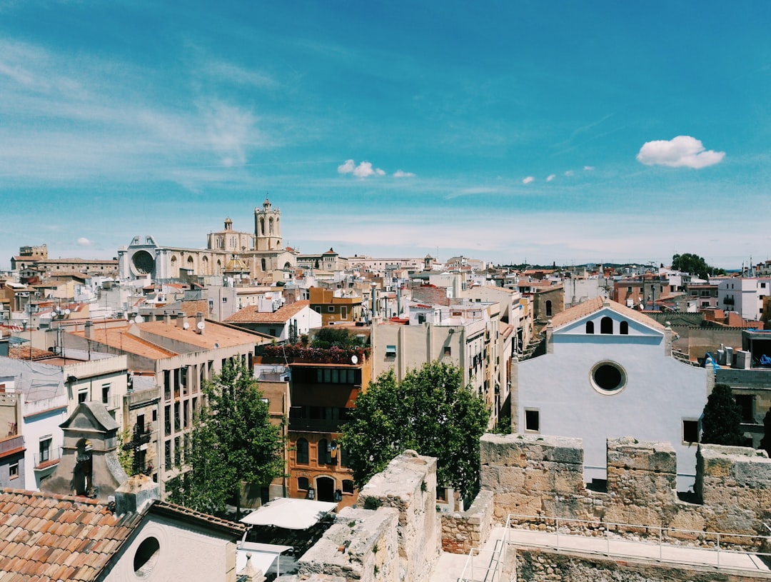 brown concrete building under blue sky during daytime, Tarragona Views<p></figure>