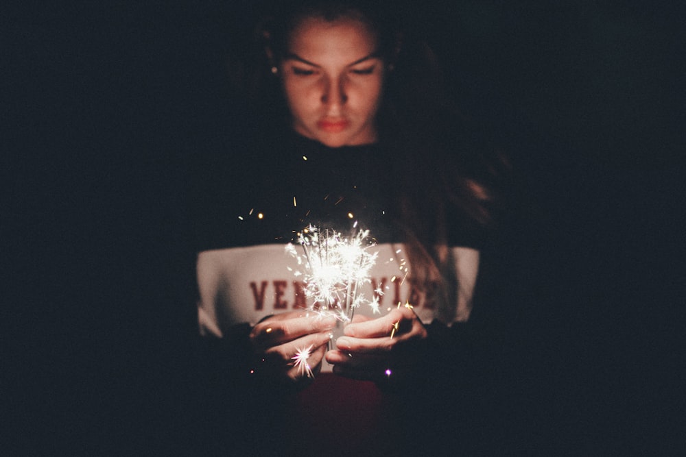 woman holding sparkler