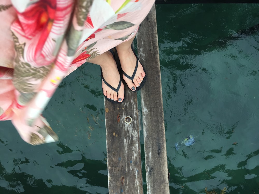 woman standing on bridge during daytime