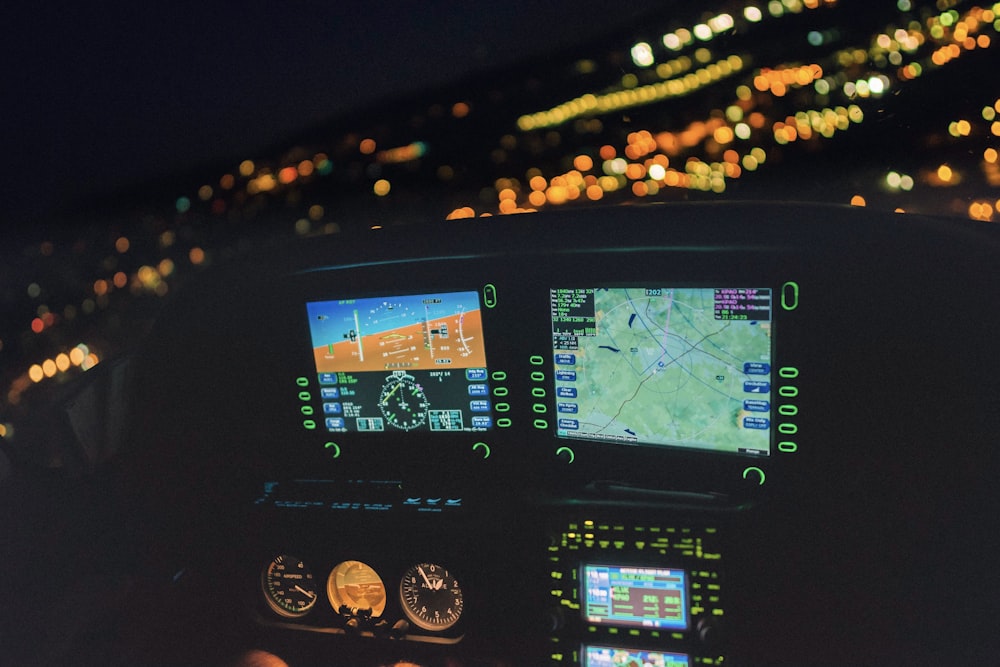 a view of the cockpit of a plane at night