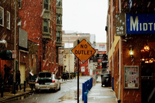No Outlet road sign beside brown concrete buildings in Philadelphia United States