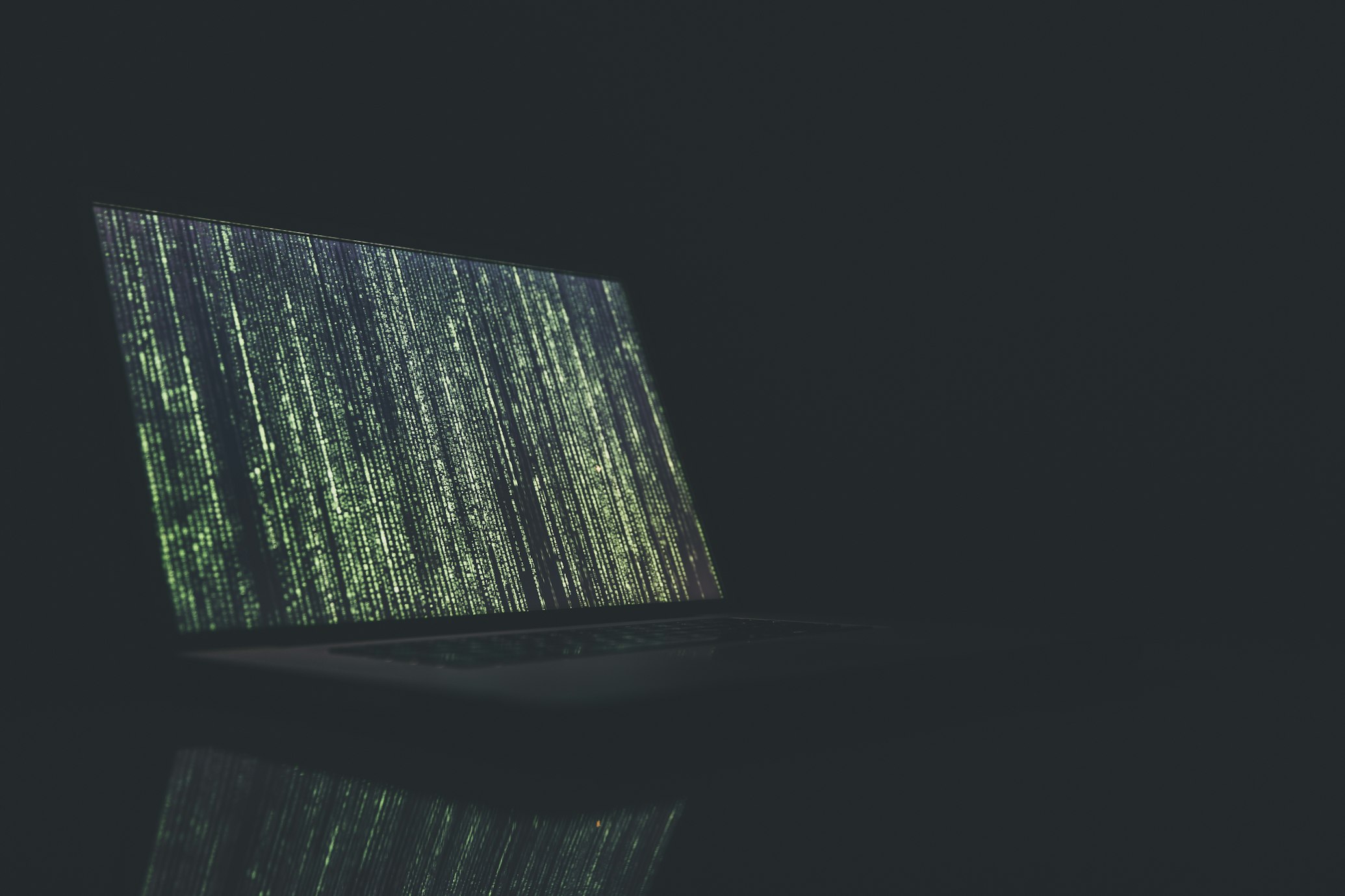 A person working on a laptop with an abstract, modern city background, symbolizing future-proofing