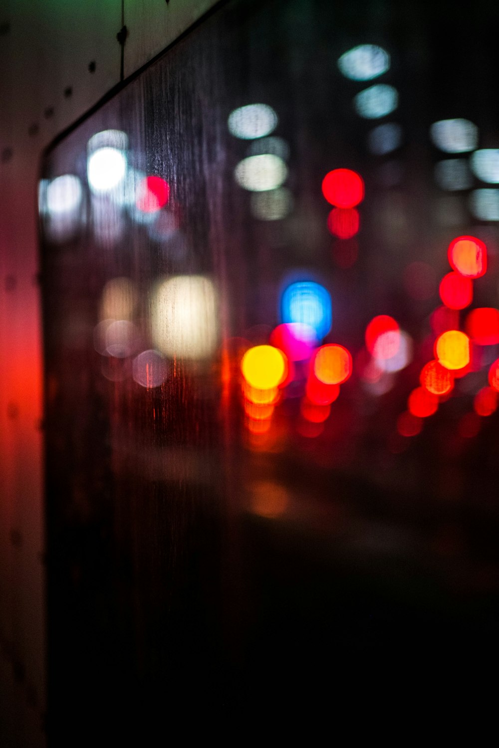 a blurry photo of a city street at night