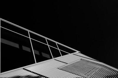 Contemporary sports complex exterior showcasing sleek architectural details in muted tones.