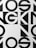 Bold black and white geometric typography with large, overlapping letters and shapes, creating an abstract pattern.
