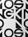 Bold black and white geometric typography with large, overlapping letters and shapes, creating an abstract pattern.