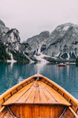 people in brown wooden boat