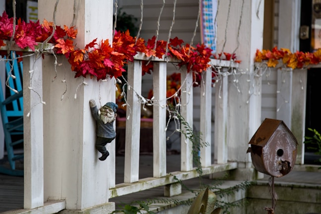 A beautifully styled porch with seasonal decor and natural textures.