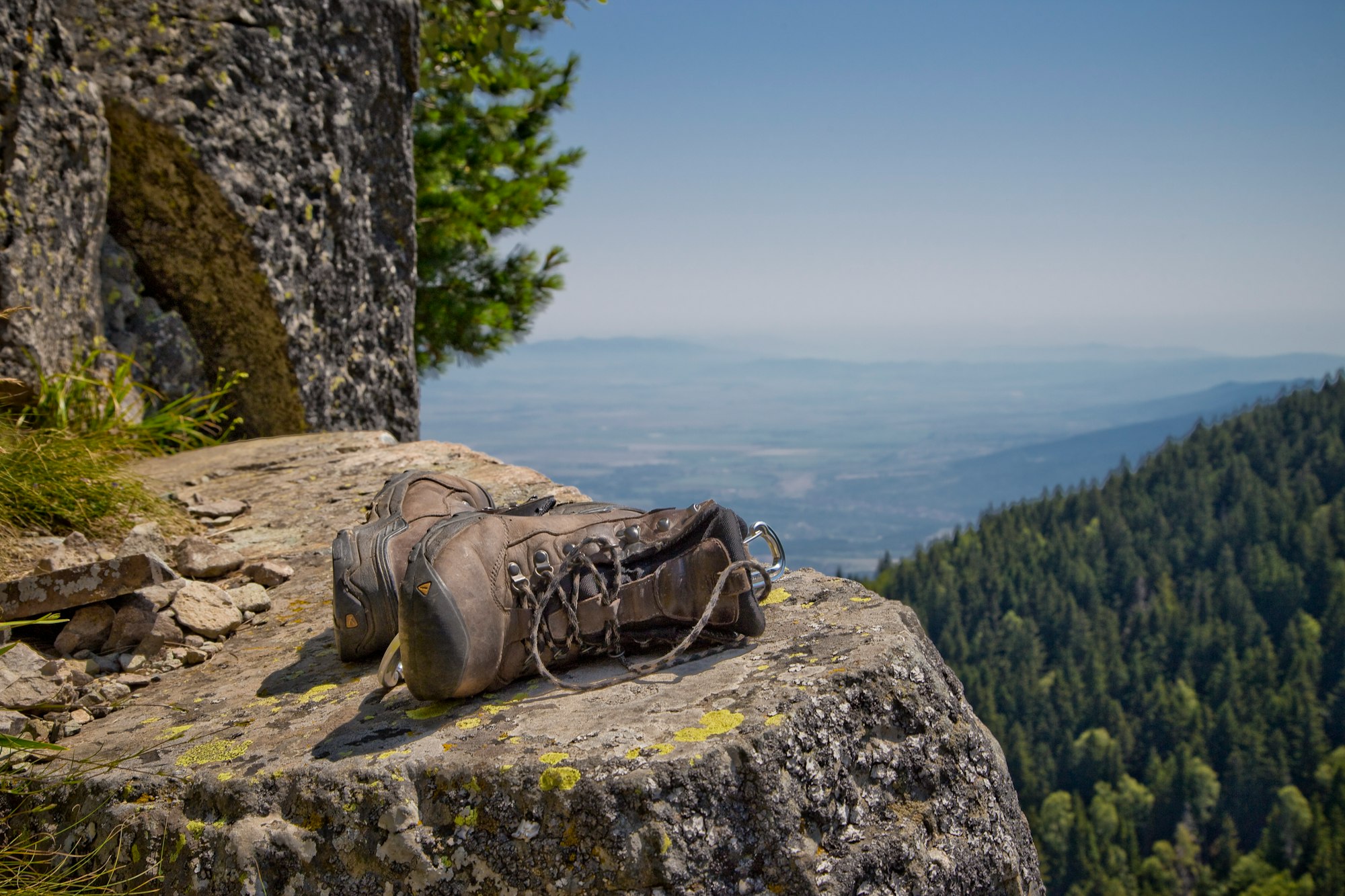 Shot while clipped into the slab at the Kominite climbing area. I’m overlooking Sofia, Bulgaria on the Vitosha mountainrange. My guide’s boots were perched just above the anchor and made for this shot. One of the best climbing days of my life.