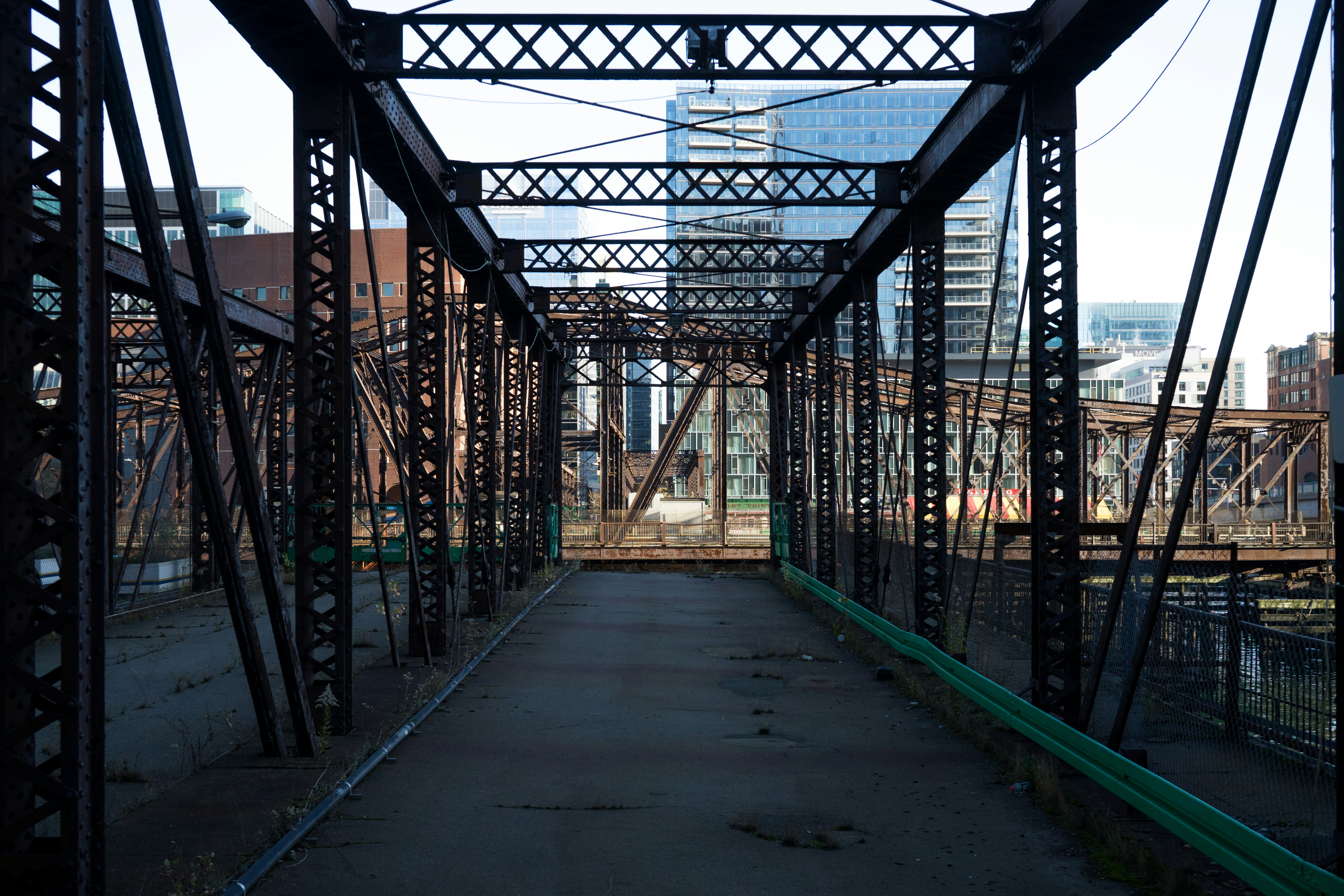 a view of a bridge with a building in the background