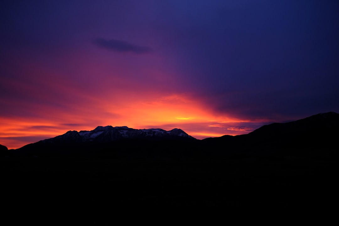 silhouette of mountain under sunset