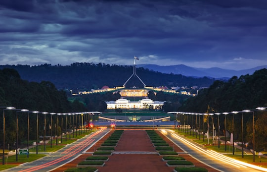 brown concrete pathway during night in Australian War Memorial Australia