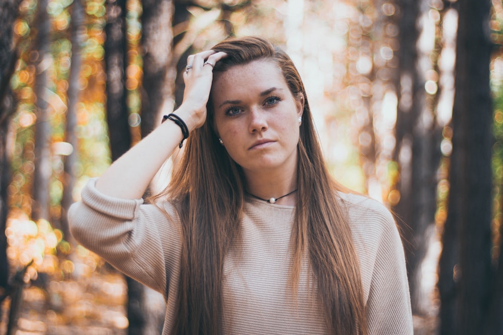 woman touching her hair