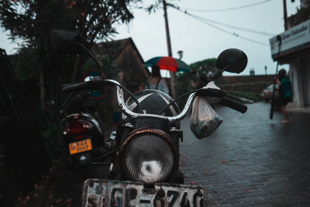 black touring motorcycle on asphalt road during daytime