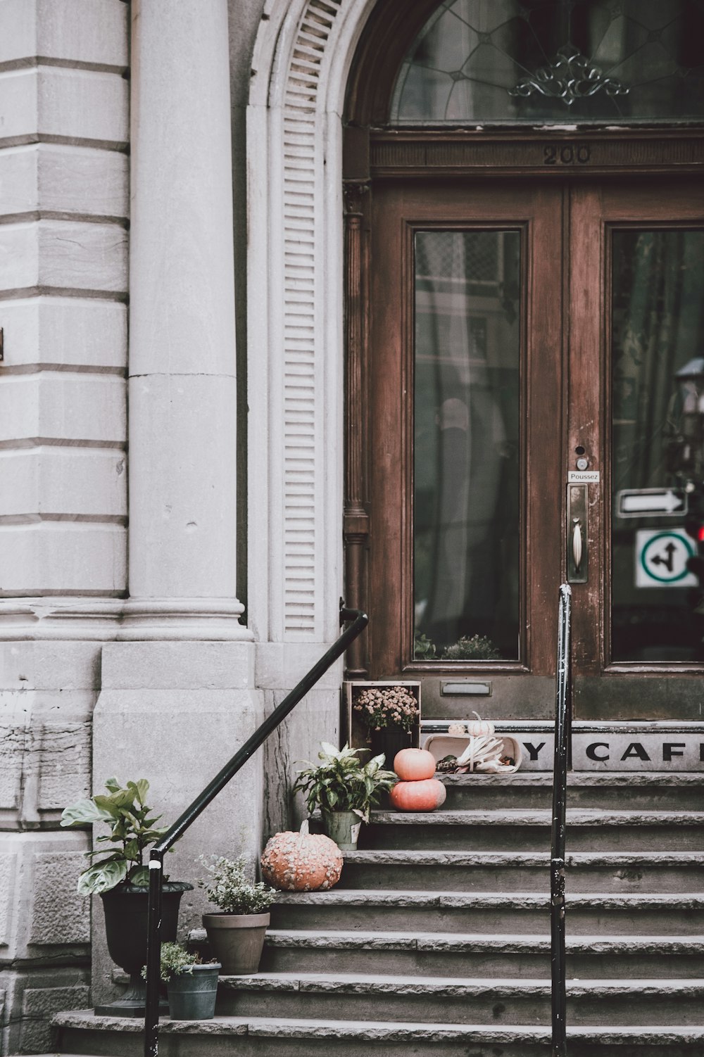 gray staircase in front of the gray wooden door