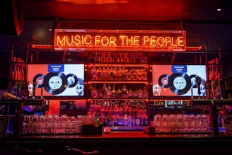 red music of the people neon-light signage