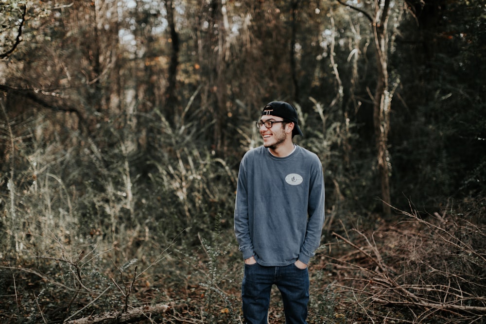 man standing on forest during daytime