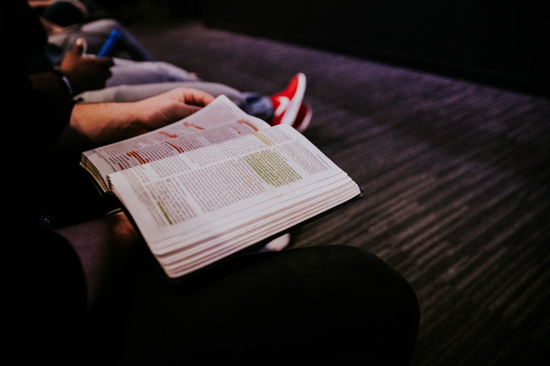 person reading book, reading the bible