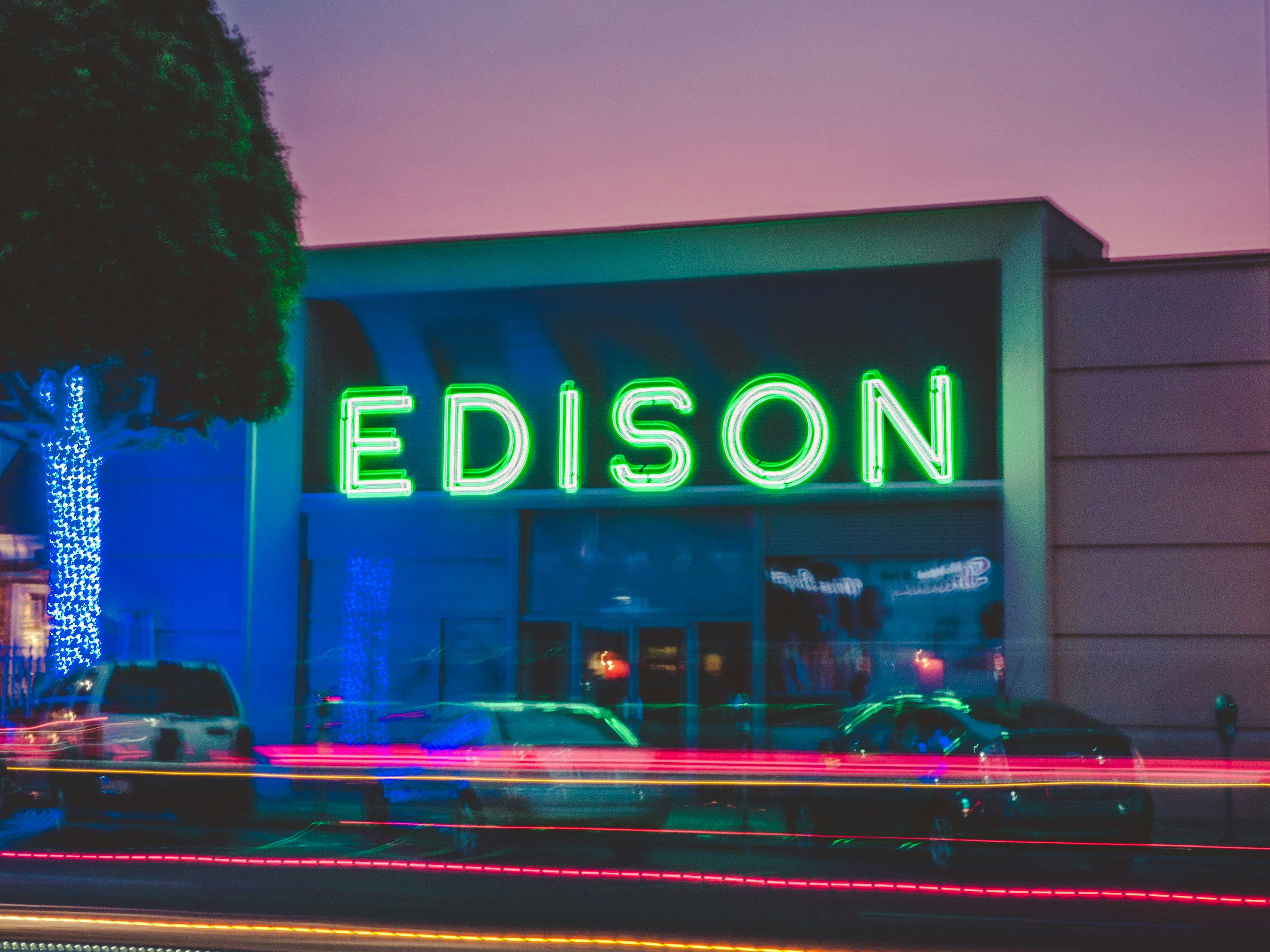 three vehicles parked in front of Edison building